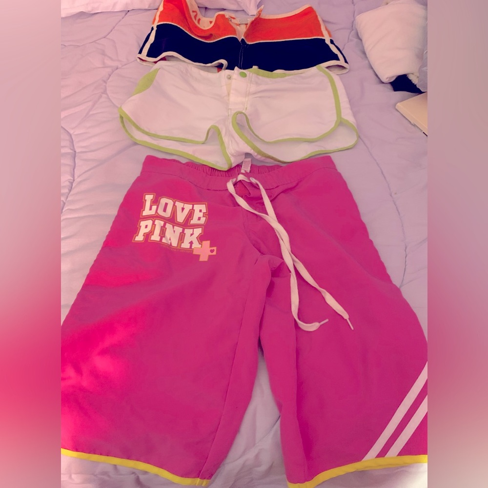 SOLD.   Great condition. Love pink long swim shorts! And two others..